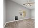 A bright, spacious bedroom with light gray walls and light wood flooring at 3248 W Sunshine Butte Dr, San Tan Valley, AZ 85144