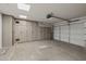 Clean garage with an automatic door and plenty of storage cabinets at 3248 W Sunshine Butte Dr, San Tan Valley, AZ 85144