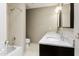 Bright bathroom offering double sinks, granite countertops, and a shower/tub combo at 33 W Missouri Ave # 17, Phoenix, AZ 85013