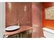 Stylish powder room with unique mosaic tile, vessel sink, and modern fixtures at 33 W Missouri Ave # 17, Phoenix, AZ 85013
