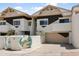 Unique townhome showcasing desert landscaping, architectural details, and a private entrance at 33 W Missouri Ave # 17, Phoenix, AZ 85013