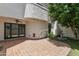 Private patio with tiled flooring, lush greenery, and a decorative fountain, perfect for relaxing at 33 W Missouri Ave # 17, Phoenix, AZ 85013