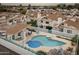 Beautiful community pool area with lounge chairs, tables and privacy fence at townhome complex at 33 W Missouri Ave # 17, Phoenix, AZ 85013