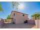 View of the backyard of the two-story home with a covered patio area at 3365 N Sunaire --, Mesa, AZ 85215