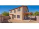 Exterior of the two-story home featuring a covered patio and spacious backyard at 3365 N Sunaire --, Mesa, AZ 85215