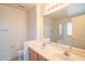 Primary bathroom featuring a dual sink vanity, shower and separate tub at 3365 N Sunaire --, Mesa, AZ 85215