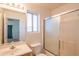 Standard bathroom with a tub, shower, toilet, sink, and window for natural light at 3365 N Sunaire --, Mesa, AZ 85215