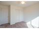 Standard carpeted bedroom featuring a ceiling fan and double door closet at 3365 N Sunaire --, Mesa, AZ 85215