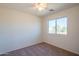 Bright bedroom with a ceiling fan and a view to the neighborhood at 3365 N Sunaire --, Mesa, AZ 85215