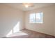 Standard carpeted bedroom featuring a ceiling fan and window for natural light at 3365 N Sunaire --, Mesa, AZ 85215