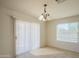 Bright dining area with tile floors, natural light, and a sliding glass door at 3365 N Sunaire --, Mesa, AZ 85215