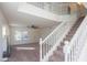 Grand entryway featuring a staircase, neutral carpet and a front door view at 3365 N Sunaire --, Mesa, AZ 85215