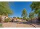 View of a sidewalk pathway in a quiet residential neighborhood, featuring gravel landscaping and desert vegetation at 3365 N Sunaire --, Mesa, AZ 85215
