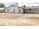 Expansive backyard with potential for landscaping and outdoor living space under a covered patio at 3556 W Augusta Ave, Phoenix, AZ 85051