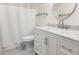 Bathroom featuring a new vanity and sink, toilet, and a framed mirror, complete with a shower curtain at 3556 W Augusta Ave, Phoenix, AZ 85051