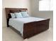 The staged bedroom features a sleek bed and a window that enhances the appeal of the space at 3556 W Augusta Ave, Phoenix, AZ 85051