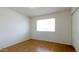 The empty tile bedroom has a window, closet and neutral colors at 3556 W Augusta Ave, Phoenix, AZ 85051