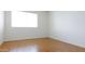 The empty tile bedroom has a window and neutral colors at 3556 W Augusta Ave, Phoenix, AZ 85051