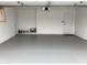 Clean and spacious garage with painted floors, offering ample storage and parking at 3556 W Augusta Ave, Phoenix, AZ 85051
