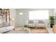 Bright living room featuring stylish furniture, decor, and natural light at 3556 W Augusta Ave, Phoenix, AZ 85051