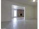 Empty living room featuring a brick fireplace and tile floors at 3556 W Augusta Ave, Phoenix, AZ 85051