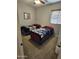 Secondary bedroom featuring two twin beds with sports-themed bedding and a window at 36119 W Catalan St, Maricopa, AZ 85138