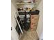 A simple closet with miscellaneous items, utility items, boxes and vacuum cleaner at 36119 W Catalan St, Maricopa, AZ 85138