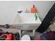 Practical utility sink area, ideal for cleaning and various household tasks, with storage for cleaning supplies at 36119 W Catalan St, Maricopa, AZ 85138