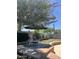 Serene backyard view of an outdoor lounge area with a patio and lush landscaping at 3811 E Evans Dr, Phoenix, AZ 85032