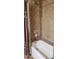 Bathroom with tiled walls, a bathtub, and a shower at 3811 E Evans Dr, Phoenix, AZ 85032