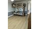 A bedroom features wooden bunk beds and light hardwood floors at 3811 E Evans Dr, Phoenix, AZ 85032