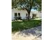 Charming single-story home with a well-manicured lawn, trimmed shrubs, and a welcoming front entrance at 3811 E Evans Dr, Phoenix, AZ 85032