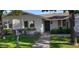 Charming single-story home with flower boxes, trimmed shrubs, and a welcoming front entrance at 3811 E Evans Dr, Phoenix, AZ 85032