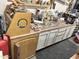 Photo shows a garage that has tools and equipment on the countertop at 3811 E Evans Dr, Phoenix, AZ 85032