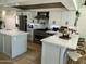 Bright, airy, and recently remodeled kitchen with stainless steel appliances and quartz countertops at 3811 E Evans Dr, Phoenix, AZ 85032