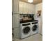 Clean laundry room featuring modern appliances and ample storage space at 3811 E Evans Dr, Phoenix, AZ 85032