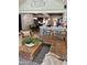 Open living space featuring a kitchen with barstool seating, dining area and comfortable living room furniture at 3811 E Evans Dr, Phoenix, AZ 85032