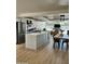 Well-lit open concept features an island kitchen, dining area, and modern appliances at 3811 E Evans Dr, Phoenix, AZ 85032