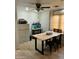 Bright home office featuring a large table, filing cabinet, and ample natural light at 3811 E Evans Dr, Phoenix, AZ 85032