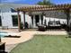 Inviting outdoor patio with pergola, comfortable seating, and poolside views for relaxing at 3811 E Evans Dr, Phoenix, AZ 85032