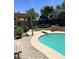Relaxing pool area featuring a pergola, diving board, and comfortable seating, perfect for outdoor enjoyment at 3811 E Evans Dr, Phoenix, AZ 85032