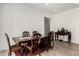 Formal dining room with wood floors, a large wood table and six chairs at 3842 E Bartlett Way, Chandler, AZ 85249