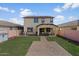 Large backyard offering a well-manicured lawn, brick pathway, and covered patio at 3936 E Narrowleaf Dr, Gilbert, AZ 85298