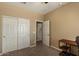 Bedroom with open doors, carpeting and a closet at 3936 E Narrowleaf Dr, Gilbert, AZ 85298