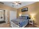 Cozy bedroom with plush carpet, decorative bedding, and a door to a closet at 3936 E Narrowleaf Dr, Gilbert, AZ 85298