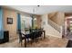 Dining room with a dark wooden table and a rug with a patterned design at 3936 E Narrowleaf Dr, Gilbert, AZ 85298