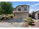 Charming home with a two-car garage, beautiful landscaping and desert-friendly shrubs at 3936 E Narrowleaf Dr, Gilbert, AZ 85298