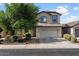 Inviting two-story home showcasing a neutral-toned exterior, well-manicured landscaping, and a spacious two-car garage at 3936 E Narrowleaf Dr, Gilbert, AZ 85298