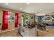 Open concept kitchen island with bar seating and great natural light from an adjacent room at 3936 E Narrowleaf Dr, Gilbert, AZ 85298