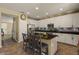 Spacious kitchen offers a large island with bar stool seating and modern stainless steel appliances at 3936 E Narrowleaf Dr, Gilbert, AZ 85298